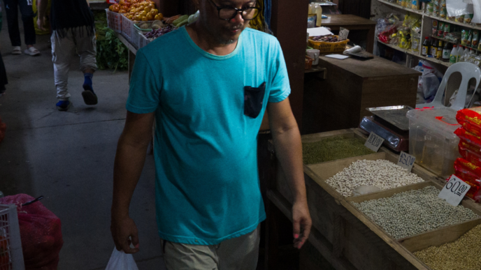 Man walking through Tiangge market
