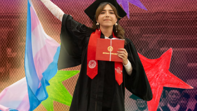 Finney Waving a Transgender Flag in her graduation